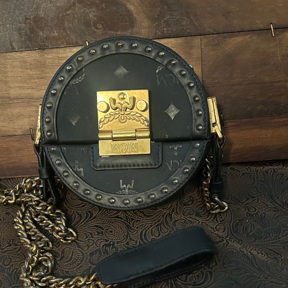MCM Handbags - MCM Black and Gold Circular Crossbody Bag